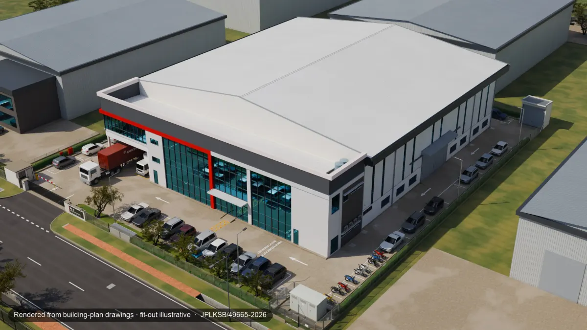 Aerial view of the whole lot: factory roof, office block, car park, lorry bays and perimeter fence
