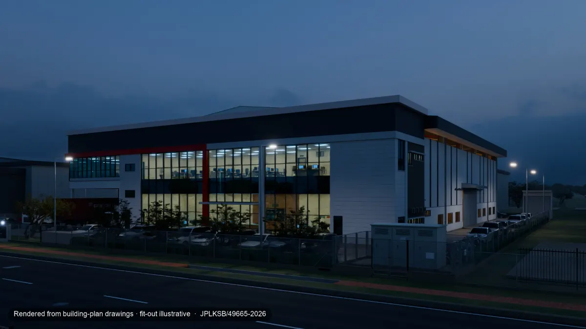 The office front at dusk with interior lights on and cars in the car park